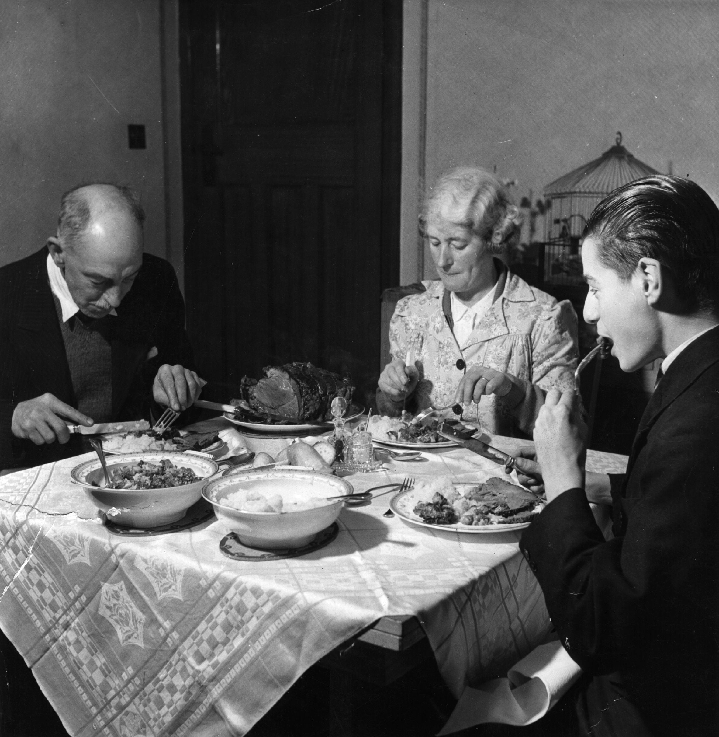 A family sharing a traditional roast lunch
