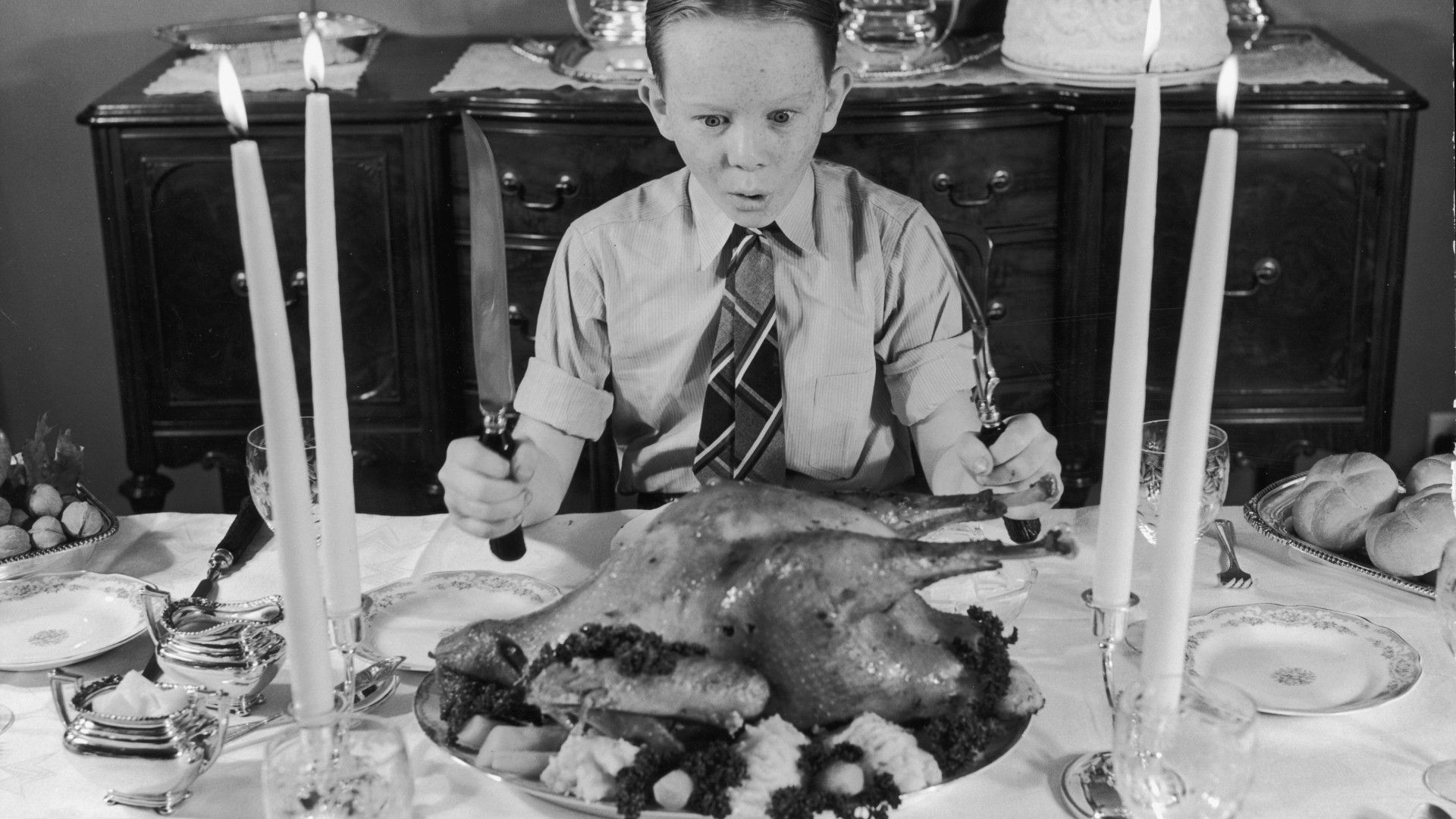 A traditional Christmas turkey ready to carve at a festive table