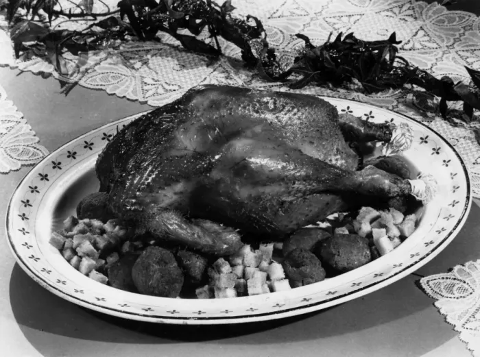 A vintage roast chicken presented on a serving platter