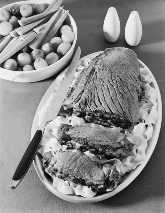 A vintage supper plate with meat, pasta and vegetables