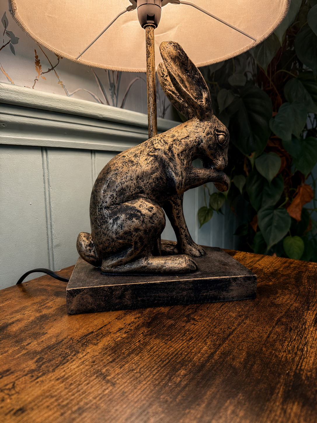 A characterful hare lamp in a cosy pub corner